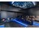 Home movie room features reclining seats, LED lighting, and a starry ceiling at 8404 Secret Key Cv, Kissimmee, FL 34747
