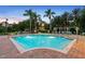 Outdoor pool featuring sparkling water, palm trees, lounge chairs, and manicured landscaping at 8404 Secret Key Cv, Kissimmee, FL 34747