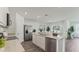 Bright, modern kitchen featuring a large island, stainless steel appliances, and open layout at 972 Fawn Grace Rd, Umatilla, FL 32784