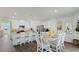 Bright, white kitchen with stainless steel appliances and a cozy dining area with seating for six at 972 Fawn Grace Rd, Umatilla, FL 32784