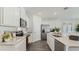 Beautiful kitchen with stainless steel appliances and white cabinets offers a clean and modern aesthetic at 972 Fawn Grace Rd, Umatilla, FL 32784