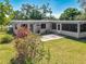 This house features a serene backyard and patio at 1228 Vantage Dr, Orlando, FL 32806