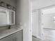 Bathroom with vanity, modern hardware, lighting and hard-surface floors at 1228 Vantage Dr, Orlando, FL 32806