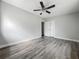 This bedroom is features hard-surface floors, closet and modern ceiling fan at 1228 Vantage Dr, Orlando, FL 32806