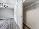 Bright bedroom featuring wood-look floors, ceiling fan, closet and neutral walls at 1228 Vantage Dr, Orlando, FL 32806