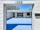 Charming courtyard entrance with modern accents and blue concrete at 1228 Vantage Dr, Orlando, FL 32806