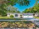 Charming single-story home featuring a well-manicured lawn, and two-car garage at 1228 Vantage Dr, Orlando, FL 32806