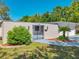 Charming single-story home featuring a gated front yard and a two-car garage at 1228 Vantage Dr, Orlando, FL 32806