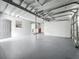Spacious garage featuring painted floors and walls, ready for parking and storage at 1228 Vantage Dr, Orlando, FL 32806