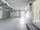 Bright garage with painted floor, automatic door, and an entrance to the house at 1228 Vantage Dr, Orlando, FL 32806