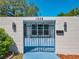 Inviting gated entrance with decorative black iron gate and tidy landscaping at 1228 Vantage Dr, Orlando, FL 32806