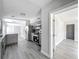Open concept kitchen with gray cabinets and modern appliances, flowing into the dining area at 1228 Vantage Dr, Orlando, FL 32806