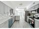 Stylish kitchen featuring stainless steel appliances, sleek countertops, and ample cabinet space at 1228 Vantage Dr, Orlando, FL 32806