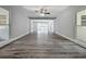 Open-concept living room with updated flooring, recessed lighting, and gray walls at 1228 Vantage Dr, Orlando, FL 32806
