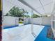 Spacious outdoor patio area enclosed by a solid white wall for privacy at 1228 Vantage Dr, Orlando, FL 32806