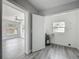 Laundry room featuring wood-look flooring, updated fixtures, and a utility sink at 1228 Vantage Dr, Orlando, FL 32806