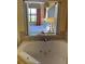 Elegant bathroom features a luxurious tub and a view into the cozy bedroom at 12527 Floridays Resort Dr # 311E, Orlando, FL 32821