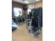 Bright community gym features various workout machines and wall-mounted televisions at 12527 Floridays Resort Dr # 311E, Orlando, FL 32821