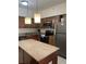 Well-equipped kitchen with modern appliances, granite countertops, and ample cabinet space at 12527 Floridays Resort Dr # 311E, Orlando, FL 32821