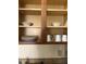 Well-organized kitchen cabinet with plates and mugs for easy access and storage at 12527 Floridays Resort Dr # 311E, Orlando, FL 32821