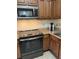 Stylish kitchen features updated appliances, ample countertop space, and modern finishes at 12527 Floridays Resort Dr # 311E, Orlando, FL 32821