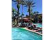 Pool side view showing the zero entry, pool, palm trees and lounge chairs, great for relaxing at 12527 Floridays Resort Dr # 311E, Orlando, FL 32821