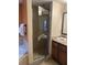 Modern bathroom features a glass shower, separate bathtub, and elegant vanity with granite countertops at 12527 Floridays Resort Dr # 603E, Orlando, FL 32821