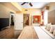 Comfortable bedroom with a queen-sized bed, warm lighting, and convenient access to an ensuite bathroom at 12527 Floridays Resort Dr # 603E, Orlando, FL 32821