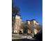 Low-angle exterior of building with parking lot in front, trees surrounding and blue sky above at 12527 Floridays Resort Dr # 603E, Orlando, FL 32821