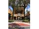 Inviting entry featuring palm trees and landscaped walkway to pool at 12527 Floridays Resort Dr # 603E, Orlando, FL 32821