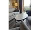 Close up of the living room with sofa, coffee table and balcony view at 12527 Floridays Resort Dr # 603E, Orlando, FL 32821