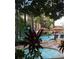 Soak in the sun by the inviting pool and hot tub surrounded by lush landscaping and resort views at 12527 Floridays Resort Dr # 603E, Orlando, FL 32821