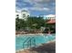 Enjoy this inviting pool with lounge chairs, a covered area, and views of the resort's architecture at 12527 Floridays Resort Dr # 603E, Orlando, FL 32821