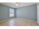Bedroom with tile flooring and a bright window, offering a simple yet comfortable retreat for relaxation and personalization at 1819 E Chapel Dr, Deltona, FL 32738