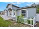 Beautiful home featuring light blue exterior paint, white trim, and charming landscaping at 1819 E Chapel Dr, Deltona, FL 32738