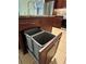 Kitchen island with pull-out trash can drawers beneath sink and granite countertops at 1819 E Chapel Dr, Deltona, FL 32738