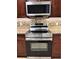 Stainless steel Samsung oven and microwave with granite countertops at 1819 E Chapel Dr, Deltona, FL 32738