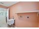 Laundry room featuring a utility sink, a shelf, and washer/dryer hookups at 1819 E Chapel Dr, Deltona, FL 32738