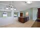 Spacious room featuring an open floor plan, tile flooring, and natural light at 1819 E Chapel Dr, Deltona, FL 32738