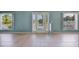 Bright living space with tile flooring, windows, and a door leading to the backyard at 1819 E Chapel Dr, Deltona, FL 32738