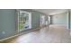 Large living room features tile flooring, neutral walls and windows with a view of the front yard at 1819 E Chapel Dr, Deltona, FL 32738