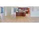 Large open-concept featuring tile floors, granite counters, and stainless steel appliances at 1819 E Chapel Dr, Deltona, FL 32738