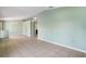 Spacious open layout with tile flooring and neutral walls, perfect for entertaining and relaxation in a versatile design at 1819 E Chapel Dr, Deltona, FL 32738