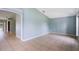 Open living room with tile floors, neutral paint, and plenty of natural light at 1819 E Chapel Dr, Deltona, FL 32738