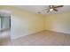 Expansive main bedroom with tile floors and doorway access, offering versatile layout options and natural light at 1819 E Chapel Dr, Deltona, FL 32738