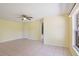 Bright and spacious main bedroom with tile floors and natural light from the window, offering a blank canvas at 1819 E Chapel Dr, Deltona, FL 32738