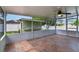 Screened in patio with tile floors and a ceiling fan, offering a pleasant outdoor space at 1819 E Chapel Dr, Deltona, FL 32738