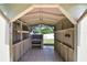 Interior of shed featuring tile floors and plenty of shelving storage at 1819 E Chapel Dr, Deltona, FL 32738