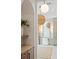 Bright bathroom features an arched mirror and vanity area at 9508 Sloane St, Orlando, FL 32827