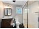 Modern bathroom featuring a glass-enclosed shower, sleek vanity, toilet, and neutral color palette at 132 Alachua Dr, Winter Haven, FL 33884